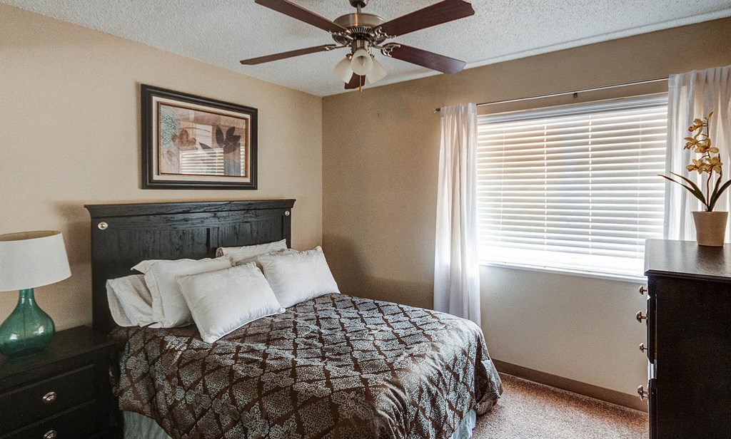 Bedroom with Ceiling Fan at University Village Apartments, Colorado Springs, Colorado