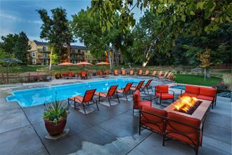 Poolside Lounge Area With Firepit at Woodland Hills Apartments, Colorado Springs