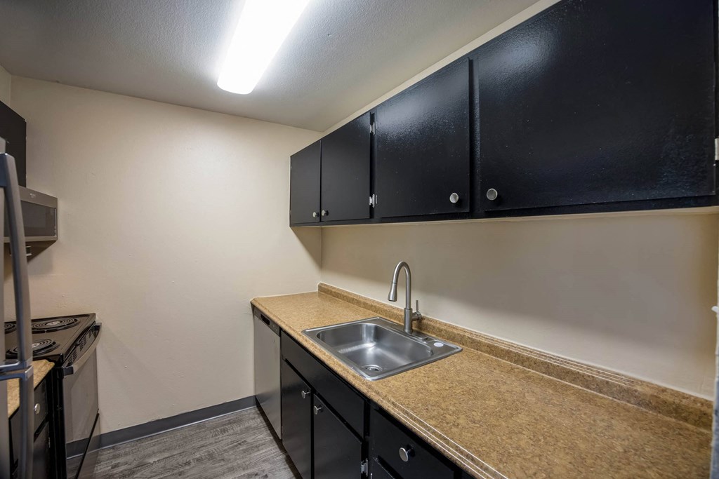 a kitchen with a sink and a microwave at Broadmoor Springs, Colorado Springs, CO, 80906