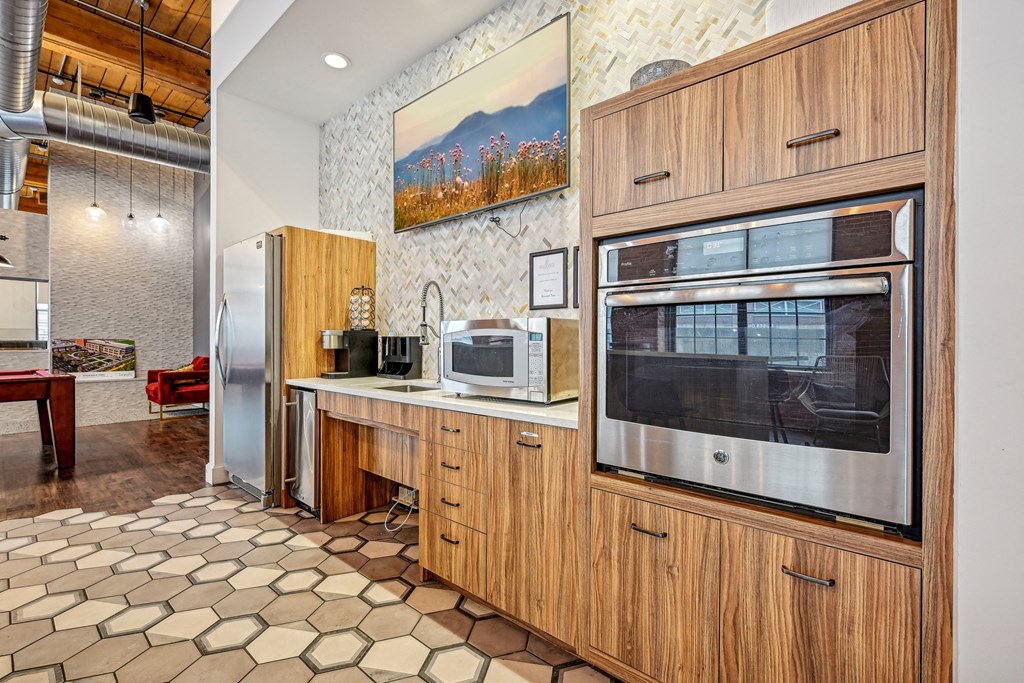 a kitchen with a microwave oven and a refrigerator at Riverwalk Apartments, Lawrence, MA