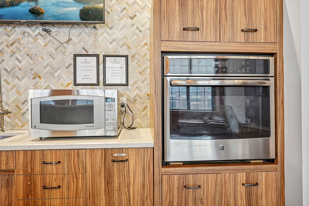 a kitchen with a microwave and a toaster oven at Riverwalk Apartments, Lawrence, MA