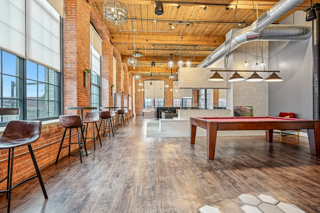 a game room with a pool table and a ping pong at Riverwalk Apartments, Lawrence, MA