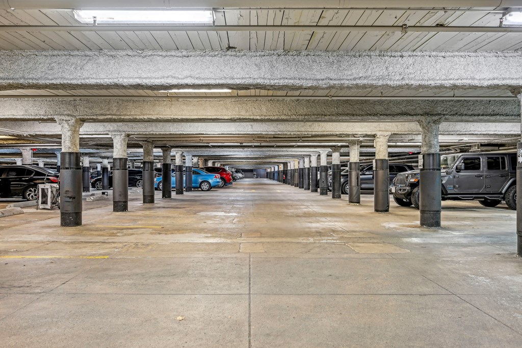 an empty parking garage with cars parked in it at Riverwalk Apartments, Lawrence, MA
