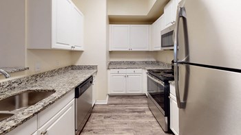 Refrigerator And Kitchen Appliances Refrigerator And Kitchen Appliances at The Arbor Walk Apartments, Tampa, FL - Photo Gallery 3
