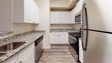 Refrigerator And Kitchen Appliances at The Arbor Walk Apartments, Tampa, FL - Photo Gallery 4