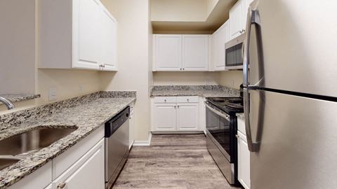 Refrigerator And Kitchen Appliances at The Arbor Walk Apartments, Tampa, FL