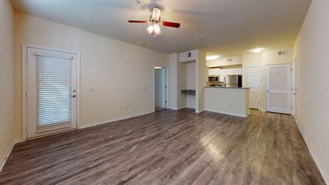 Living Area With Kitchen at The Arbor Walk Apartments, Tampa, FL, 33617