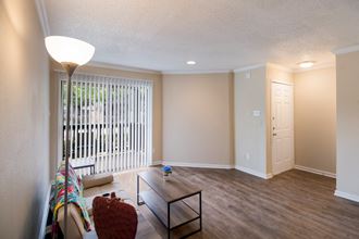 Living room with a couch and a coffee table at The Glen at Highpoint, Dallas, TX, 75243