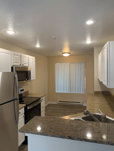 Kitchen with a Sink and Refrigerator at Arcadia Townhomes, Federal Way, WA, 98023