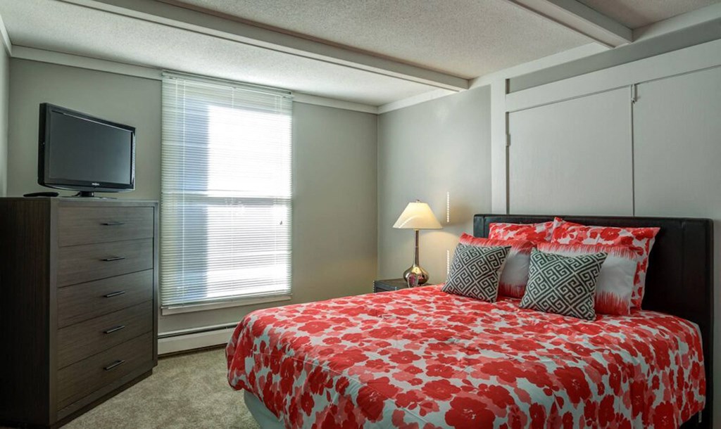 bed with orange at Glen at Burnsville, Burnsville Minnesota