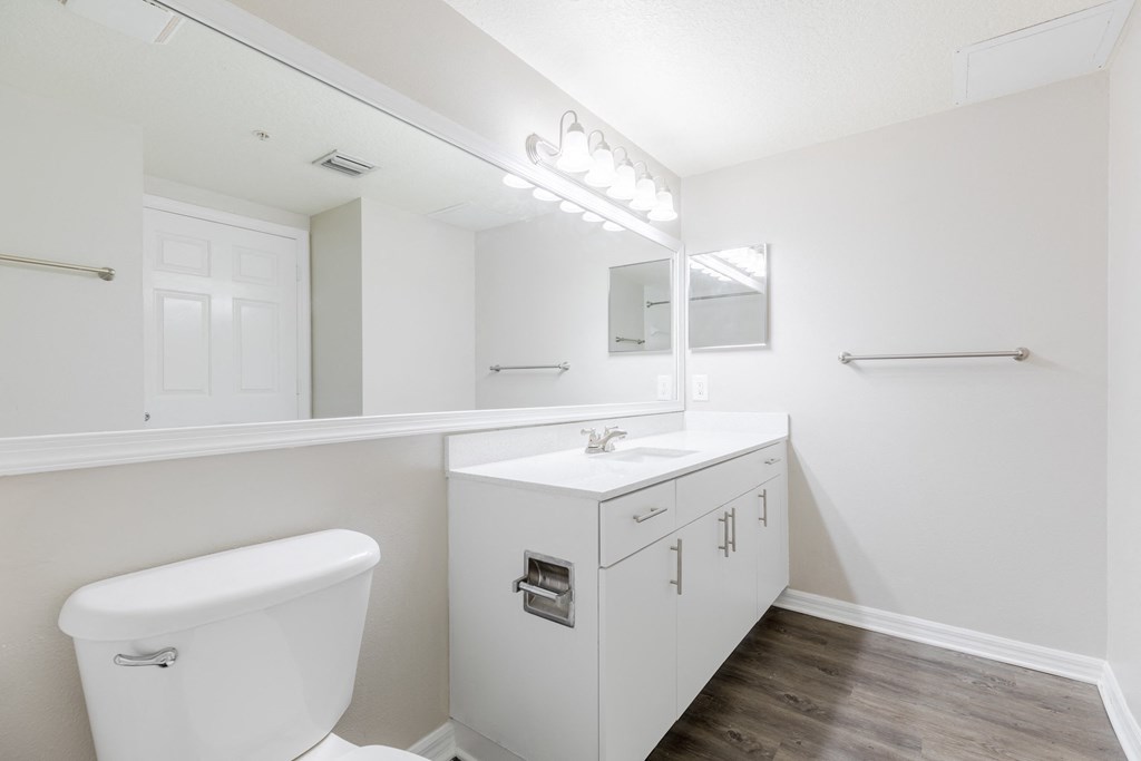 a bathroom with a toilet sink and mirror at Heritage Bay, Jensen Beach, FL 34957