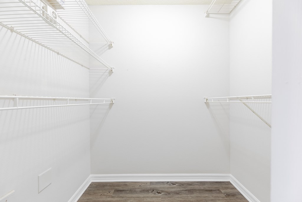 a walk in closet in a 555 waverly unit at Heritage Bay, Jensen Beach, FL