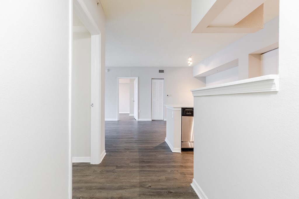 a living room with white walls and a wooden floor at Heritage Bay, Jensen Beach, 34957