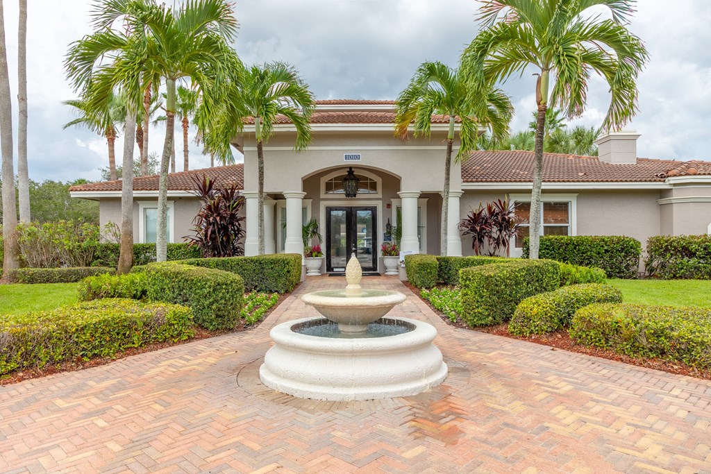 a house with a fountain in front of it at Heritage Bay, Florida