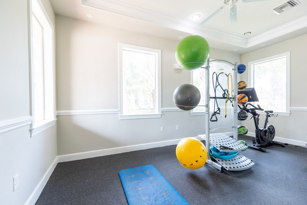 a home gym with a treadmill and exercise balls at Heritage Bay, Jensen Beach, 34957