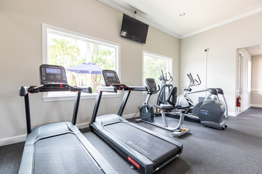 two treadmills and two ellipticals in the exercise room at Heritage Bay, Florida, 34957