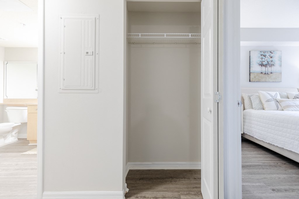 a bedroom with a bed and a closet at Heritage Bay, Jensen Beach, FL 34957