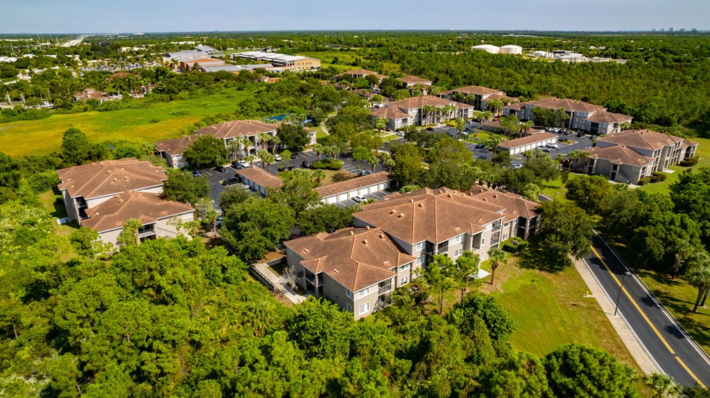arial view of a subdivision with houses and trees at Heritage Bay, Florida, 34957