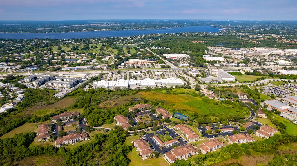 an aerial view of a city with a body of water in the background at Heritage Bay, Jensen Beach, FL