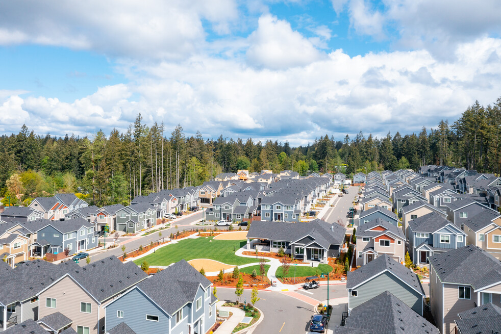 an aerial view of a neighborhood with rows of houses