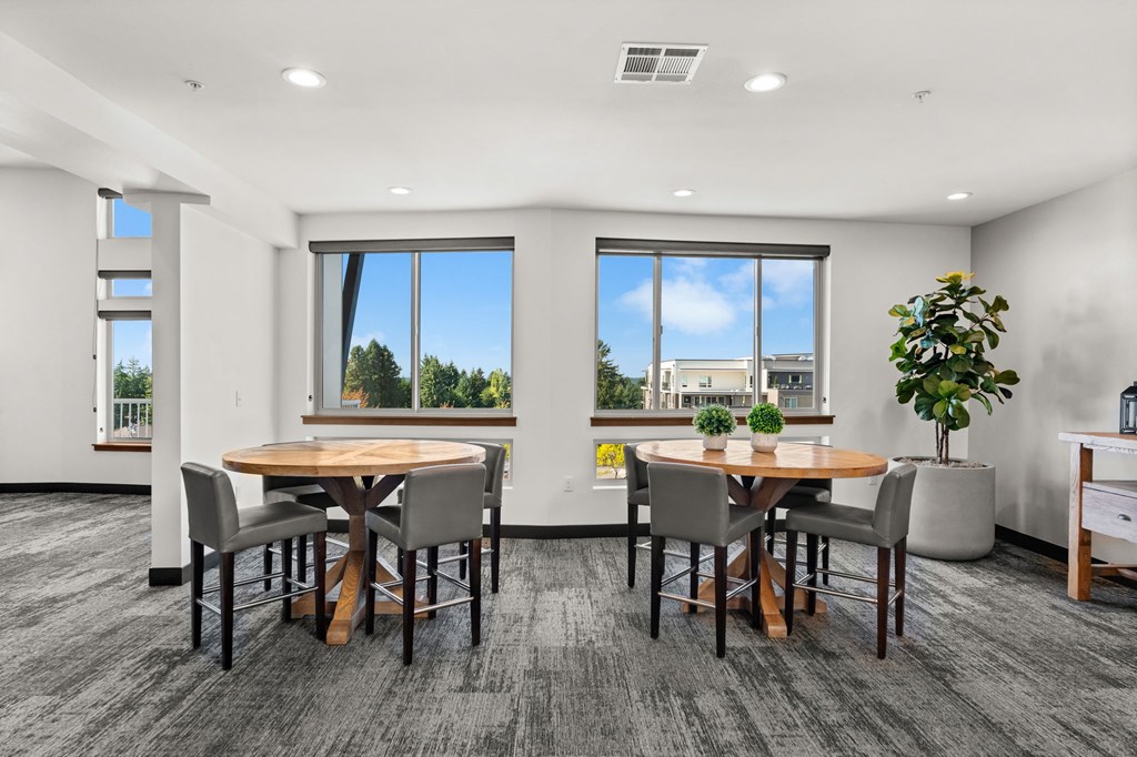 A conference room with a table and chairs.