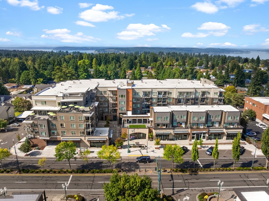 A large building with a parking lot in front of it.