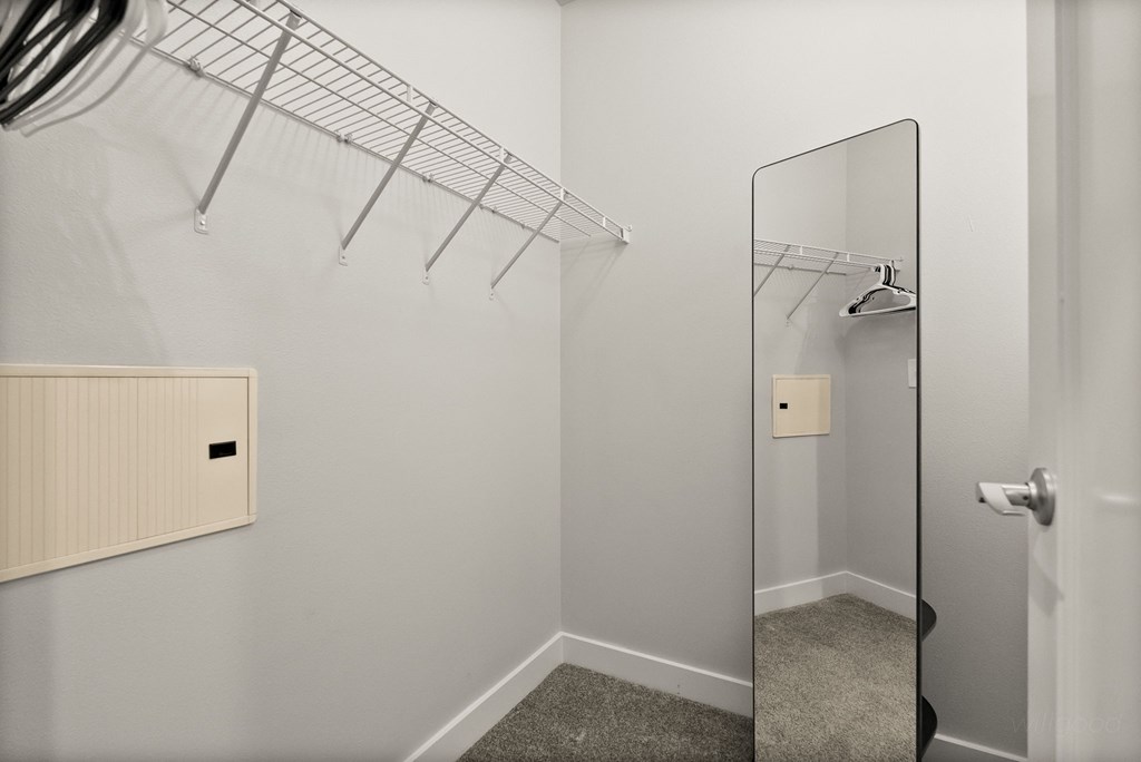 A white door with a glass window is on the right.