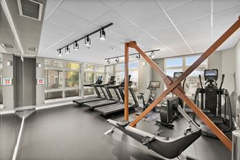 A gym with treadmills and exercise equipment.
