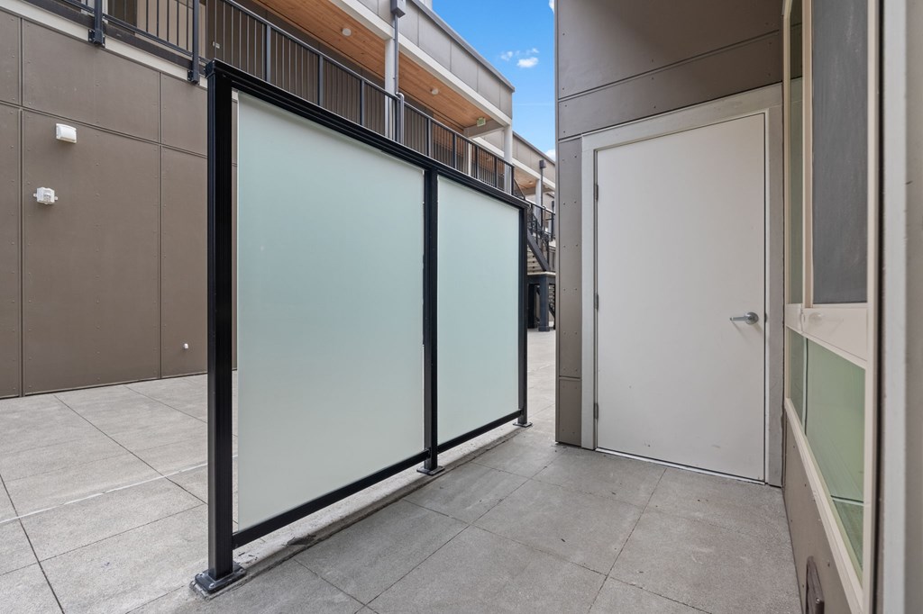 A glass door is closed with a black frame.
