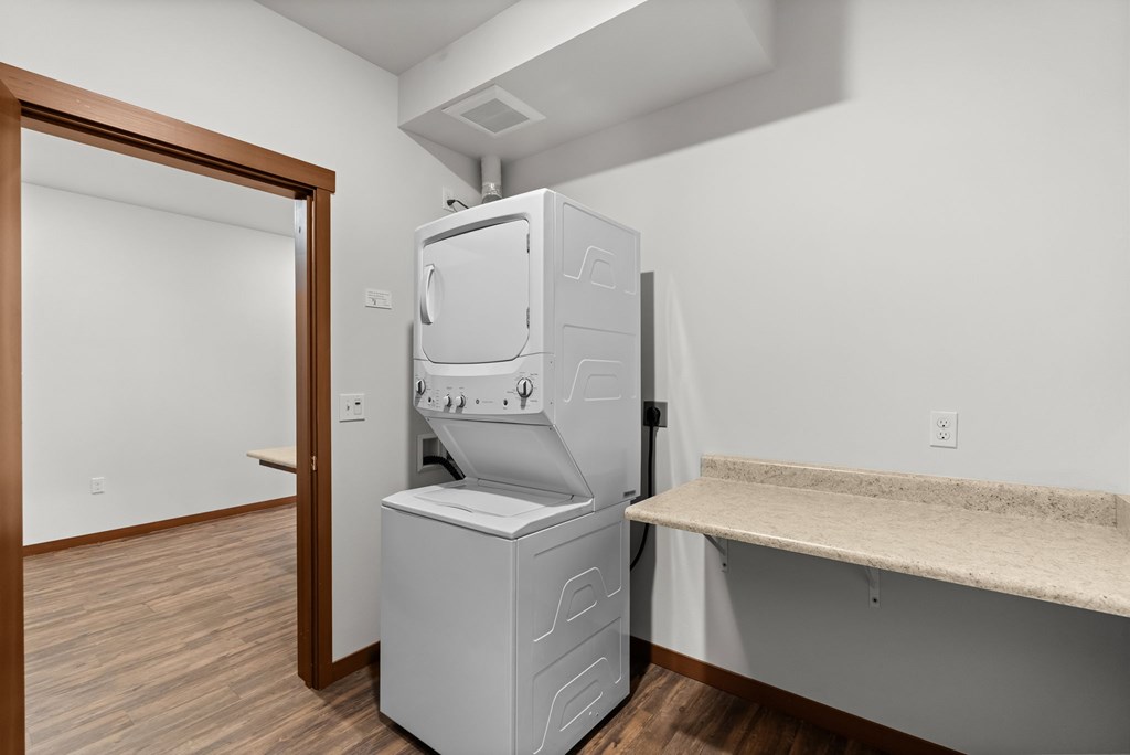 A white oven and microwave are built into a kitchen island.
