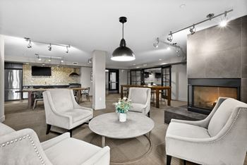 A living room with a fireplace and a TV.