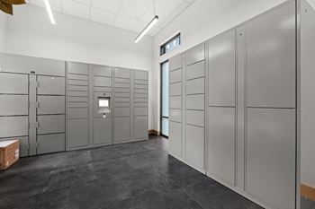 A room with grey lockers and a white ceiling.