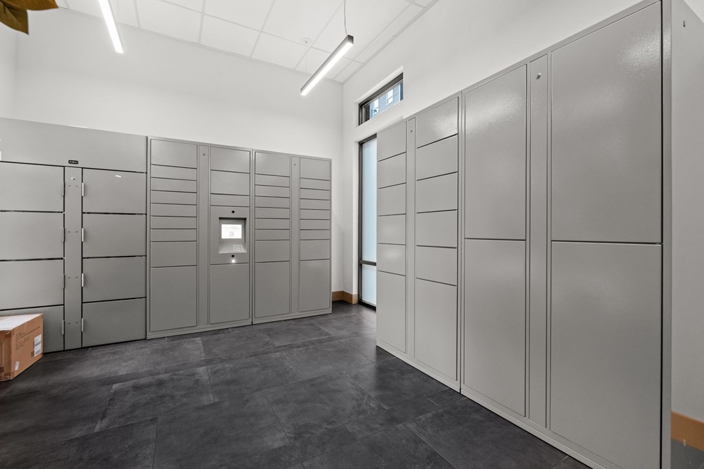 A room with grey lockers and a white ceiling.