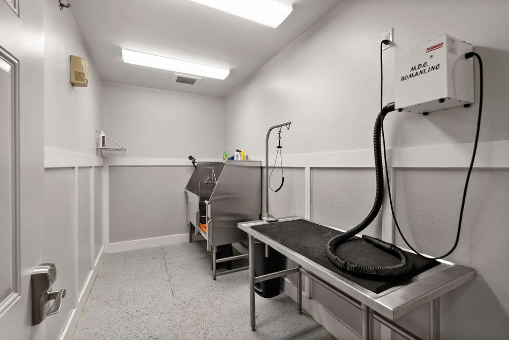 A room with a machine that has a hose coming out of it.