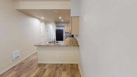 a kitchen with a counter top and a sink