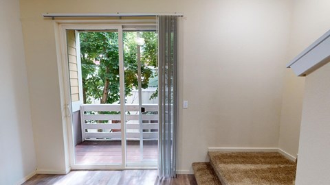 a view of a staircase with glass doors leading to a deck