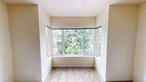 an empty room with a large window