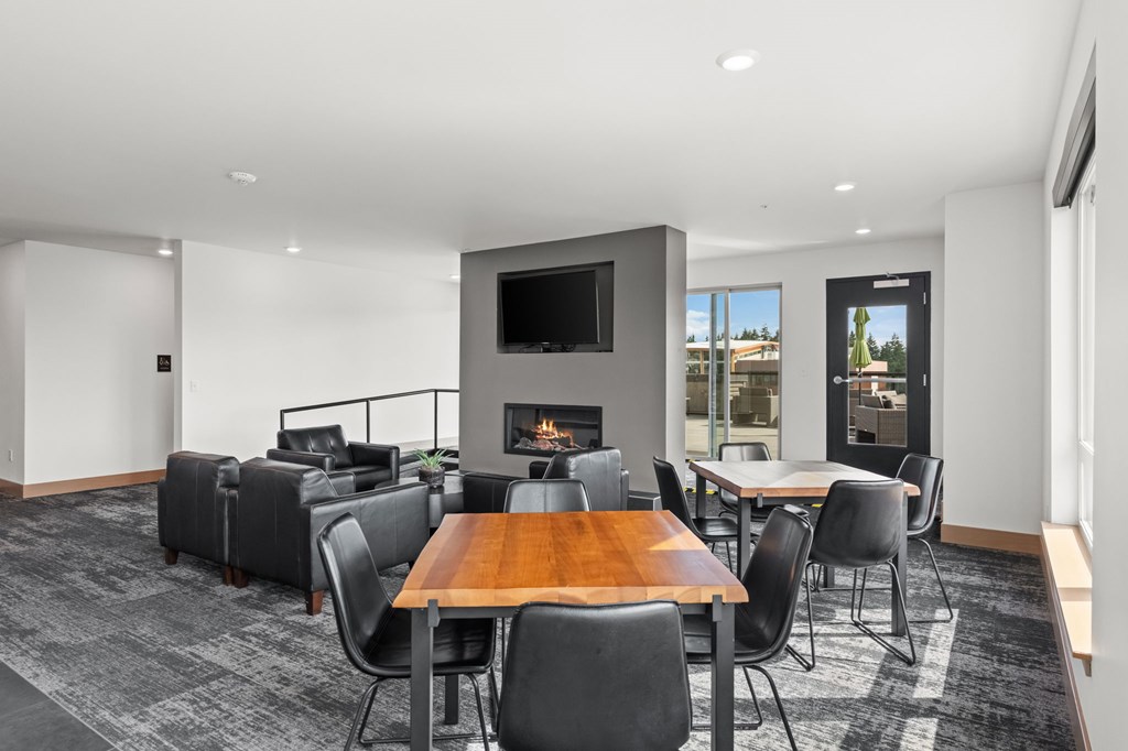 A modern living room with a fireplace and a television.
