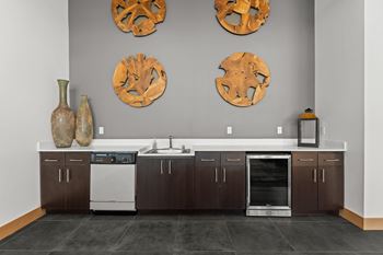 A kitchen with a white dishwasher and a white oven.