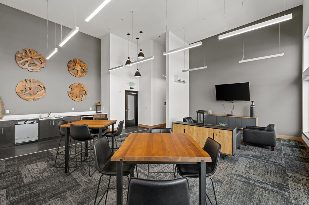 A modern office space with a wooden table and chairs.
