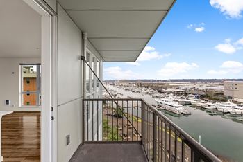 A balcony with a view of a marina.