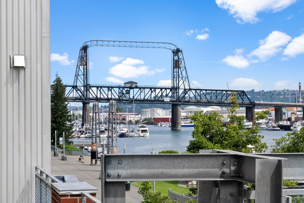 A bridge over a body of water with boats underneath.