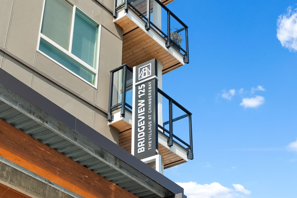 A building with a balcony and a sign that says "Bridgeview".