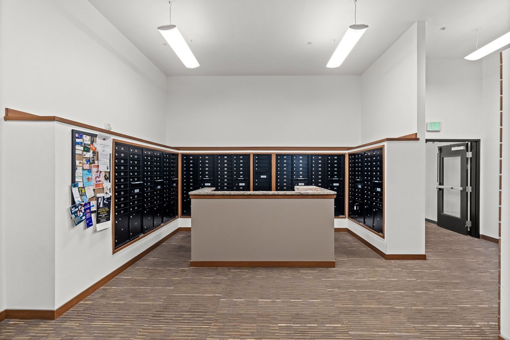 A reception area with a desk and a bulletin board.