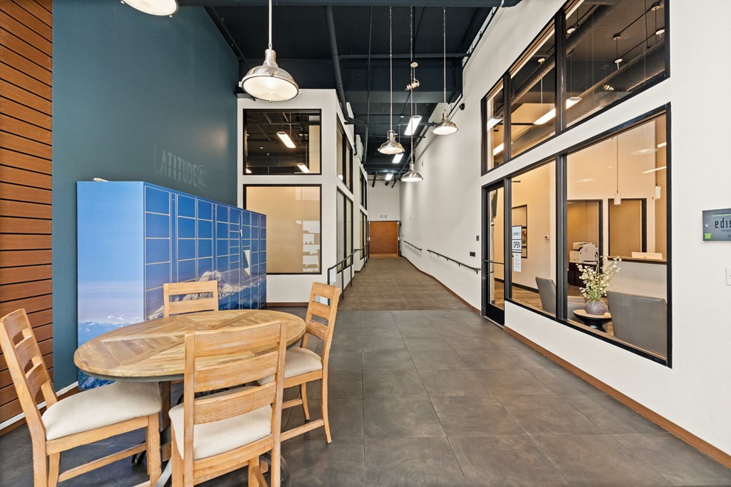 A long, narrow room with a table and chairs.