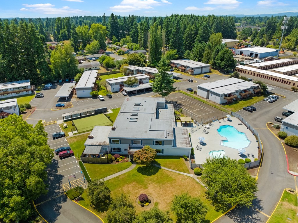 an aerial view of a city with buildings and a swimming pool