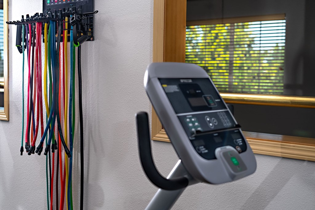 a remote control sits on a handle in a room with a window