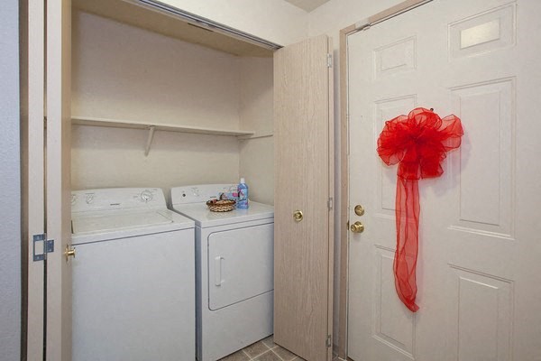 a red ribbon is hanging on a door in a laundry room