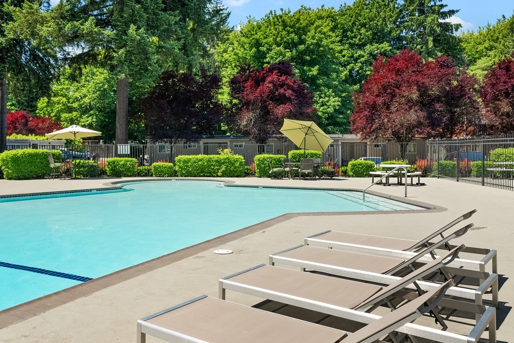 our apartments have a resort style pool and lounge chairs