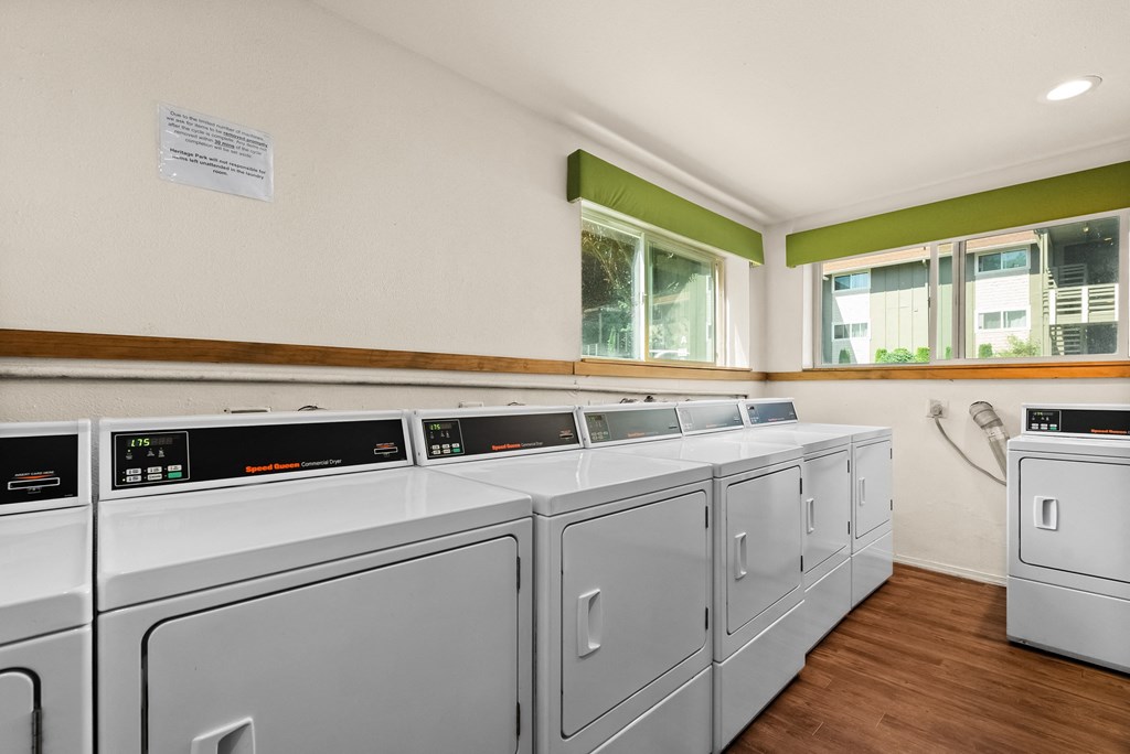 the preserve at ballantyne commons laundry room with washes and dryers